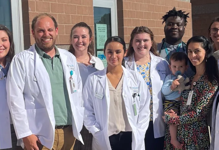 Photo of PA students and faculty as part of Project Access, including Emily Moran, Professor Martha McKean MPH, Ifedayo O. Akinyemi, Olivia Magnussen, Catherine Johnson, Erika Dooley, Emily Medina, Amy Cabrera, and Colby Young.