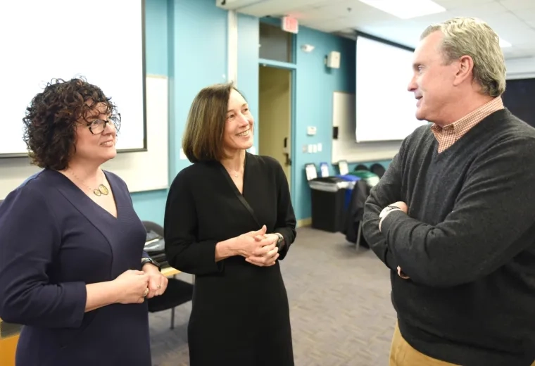 the three talk together in a classroom