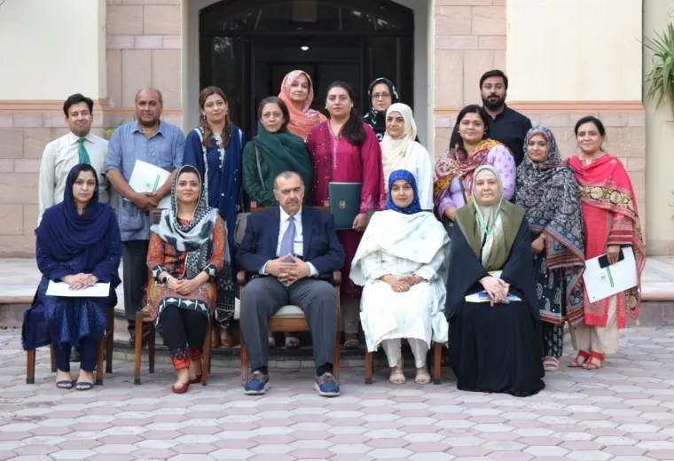 Large group of people pose for a photo in Pakistan