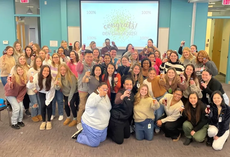 Nursing students raise toast for passing test