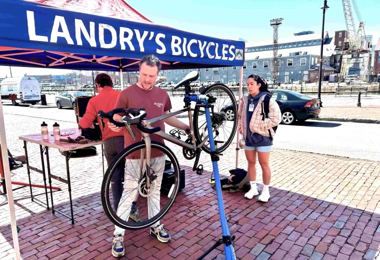 Person tuning a bicycle