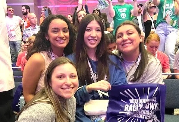 Four women smiling