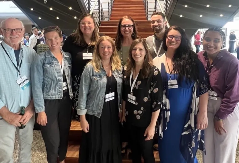 SAiL lab members pose in front of staircase.