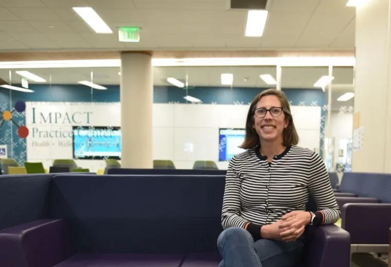 A woman sits on a couch