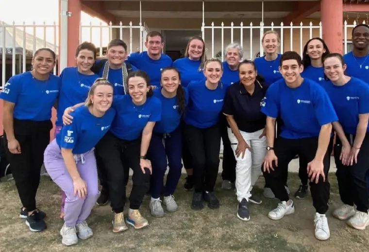 group of students posing outside of Guatemalan clinic 