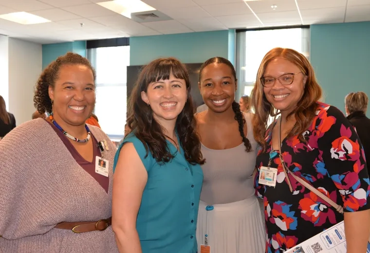 four women smiling 