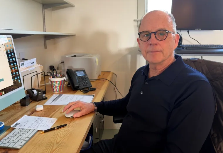 man sitting at desk 