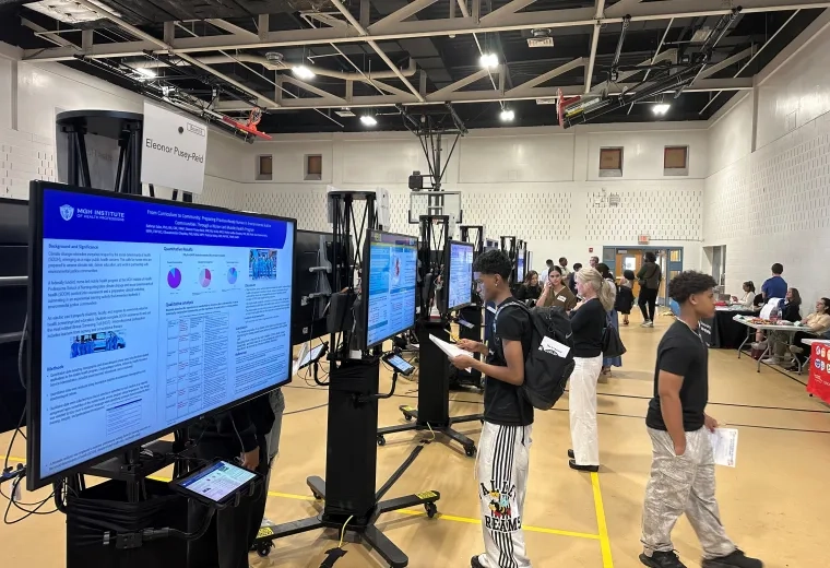 Students looking at research posters 