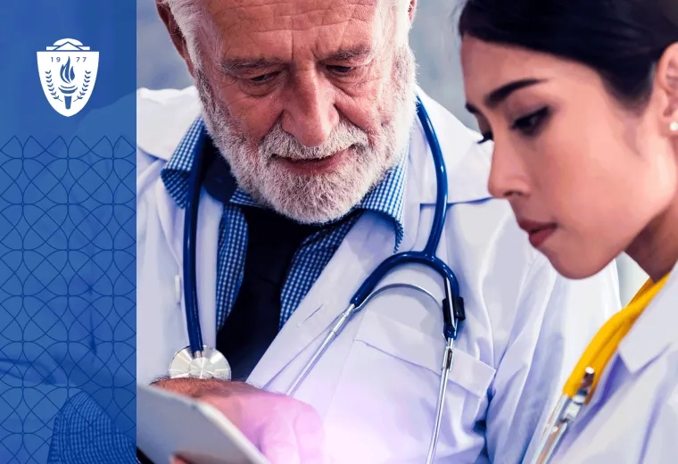 A physician educator works one-on-one with a resident physician while reviewing a digital learning platform on a tablet in a teaching hospital conference room. The image should emphasize coaching, conversation, mentorship, and collaborative learning rather than technology alone. 