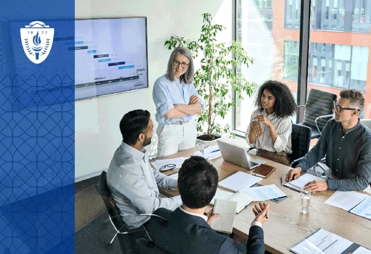 Faculty leaders from multiple health professions sit around a conference table discussing curriculum planning with dashboards, laptops, and educational materials visible. The environment should feel collaborative, strategic, and grounded in academic leadership. 