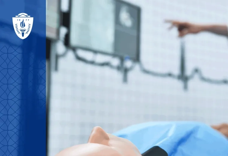 A healthcare simulation mannequin laying on it's back with EKG lines visible on the background