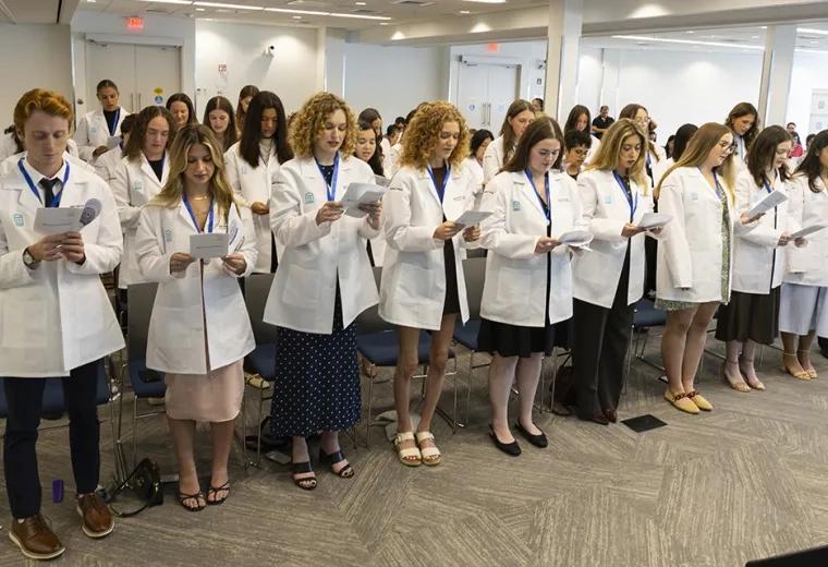 Occupational Therapy students read a pledge at the pinning ceremony