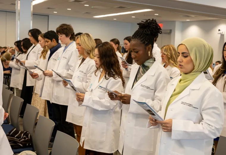 several people standing with white coats