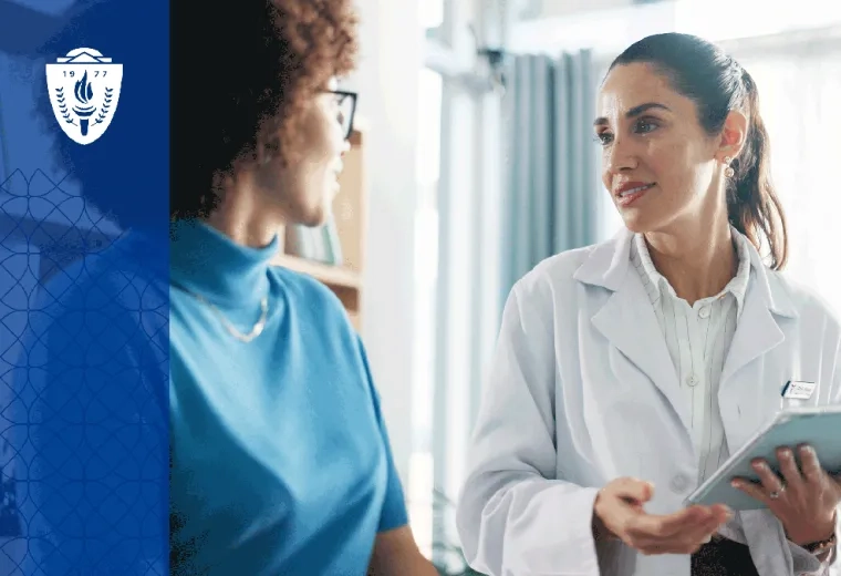 Physical therapy student speaking with a patient in a community clinic setting  A physical therapy student sits at eye level with a patient during a conversation about care goals, emphasizing communication, empathy, and patient-centered care. 