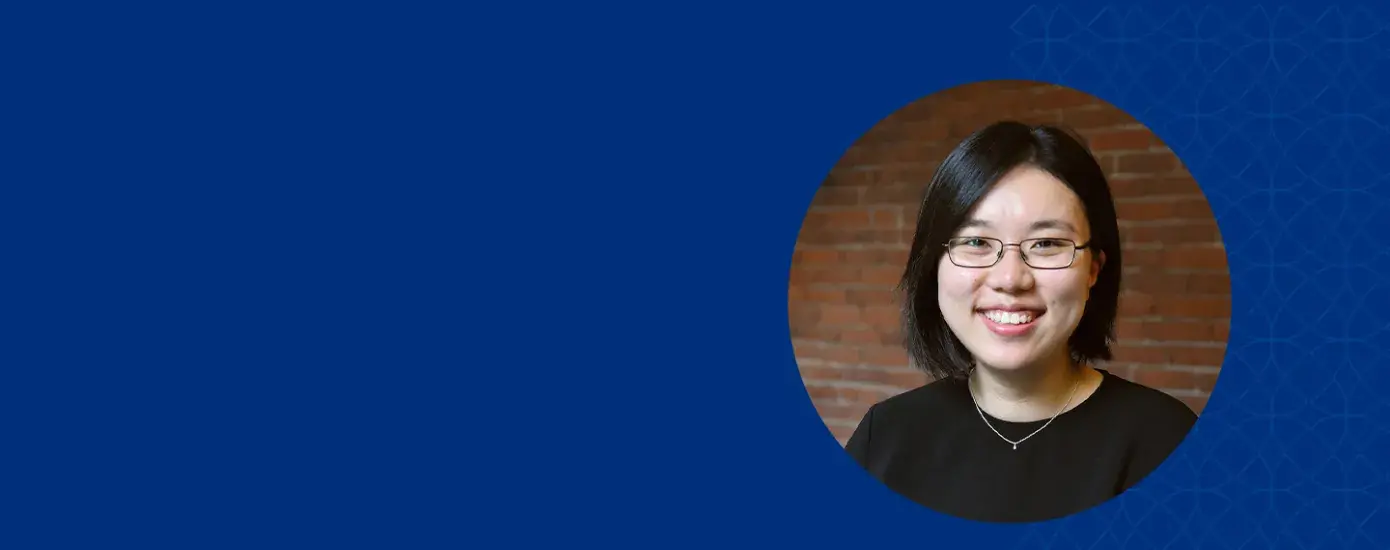 xue has straight black hair and rectangular glasses