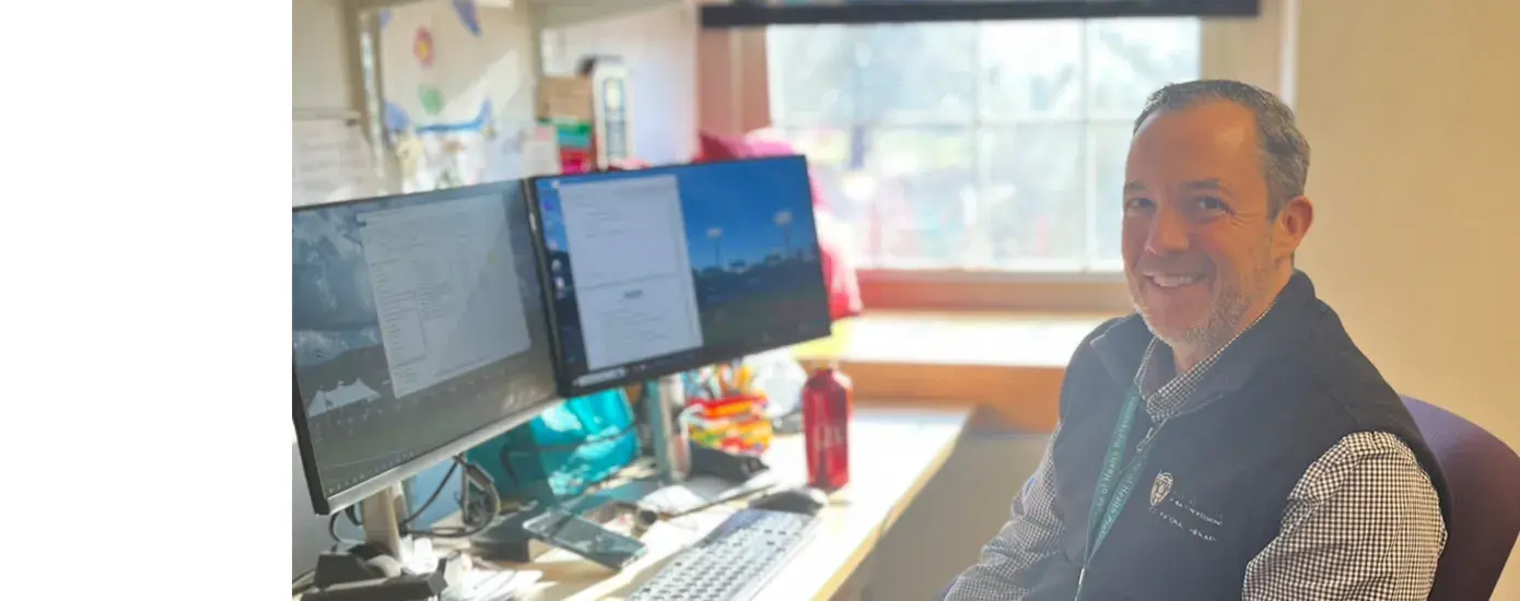  man sits at desk