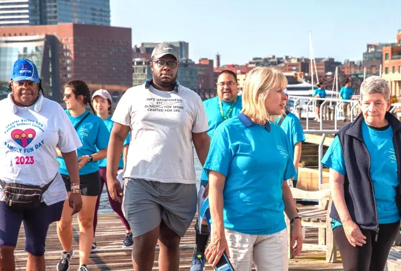People walking on a pier
