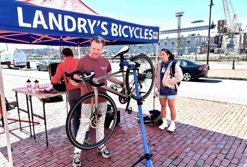 Person tuning a bicycle