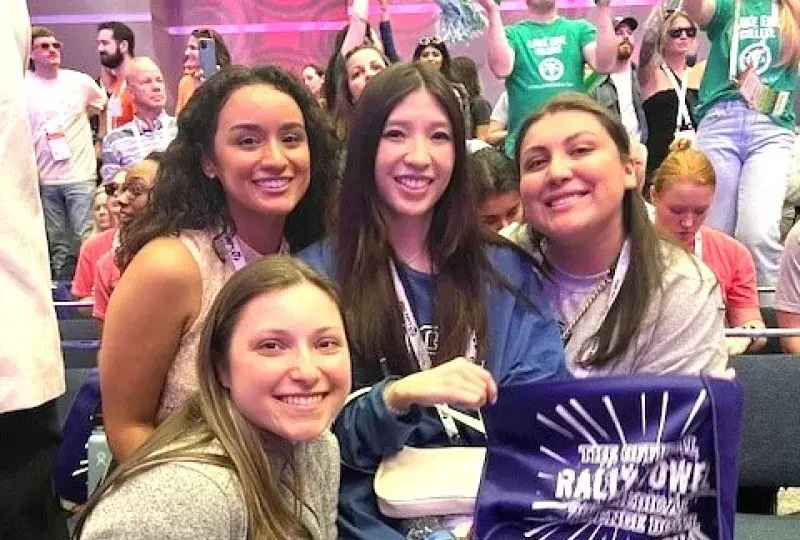 Four women smiling