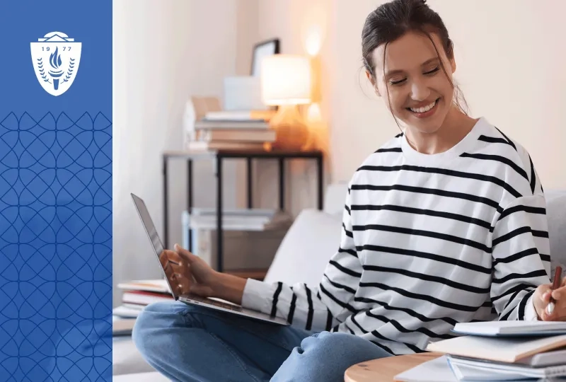 Adult learner studies nursing coursework at home during a career transition.  