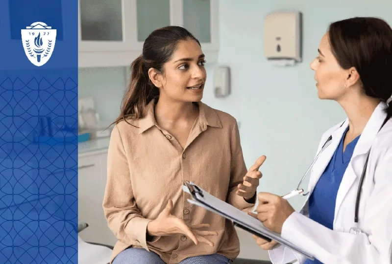a women's health nurse practitioner goes talks to a patient sitting in an exam room