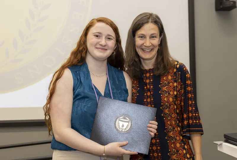 Helen Cohen and Lauryn Zipse pose with the Kenneth N. Stevens Student Research Award