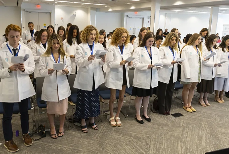 Occupational Therapy students read a pledge at the pinning ceremony