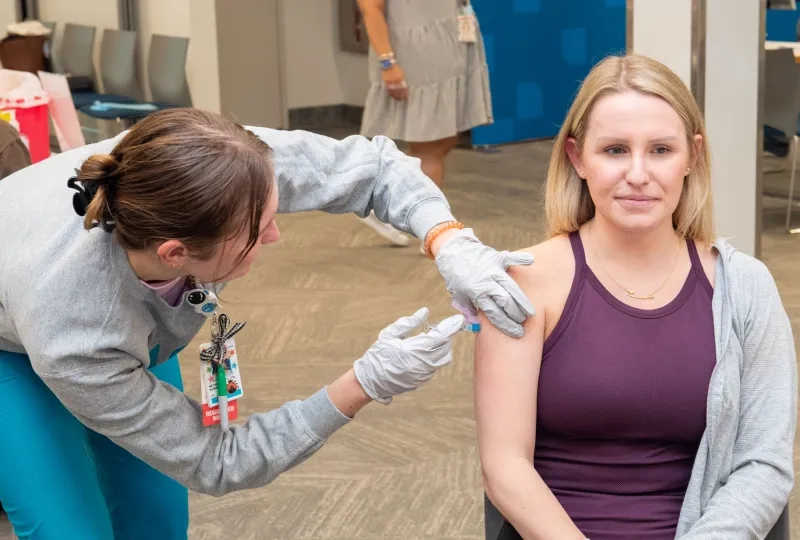 A woman receives a flu vaccination