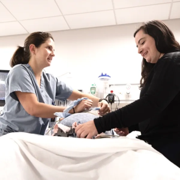 Nursing students in the Direct-Entry Master's in Nursing Program practicing patient care skills.