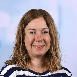 mary wears a navy and white striped top