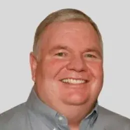 Daniel McGovern in grey collared shirt