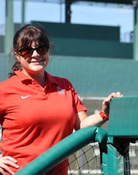 Woman standing in baseball field