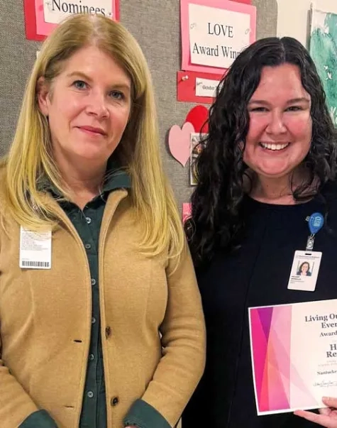 Nantucket Cottage President Amy Lee with Hillary Reynolds holding the L.O.V.E Award certificate 