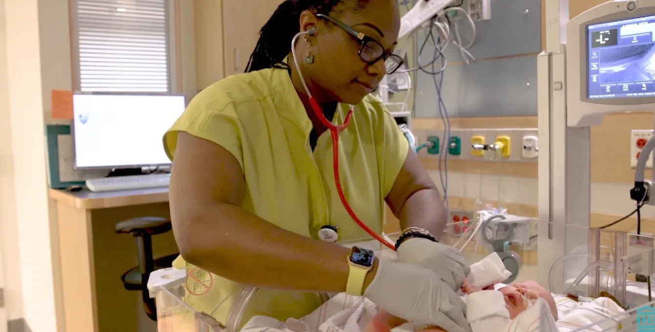 A student nurse in the Fast-Track BSN Program performing a newborn assessment as part of the accelerated nursing curriculum. This intensive nursing training focuses on preparing students for nursing licensure through hands-on experiences in a high-paced clinical environment.